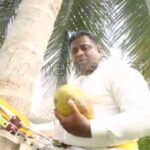 Sri Lankan Minister climbs coconut tree to address public